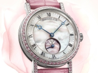 Tres relojes de lujo y amor que pintan el tiempo de color de rosa.